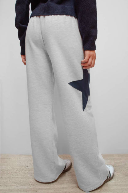 Wide-leg joggers with star | Subdued