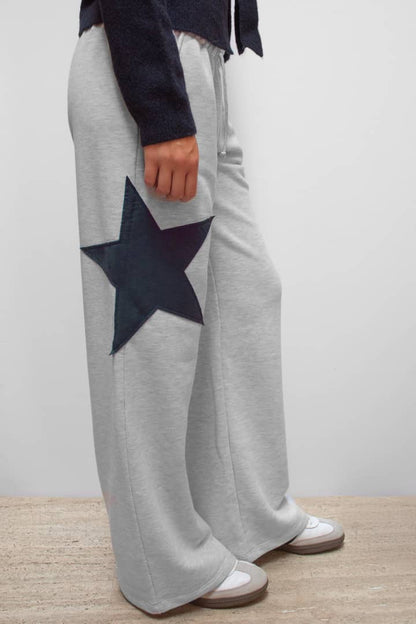 Wide-leg joggers with star | Subdued