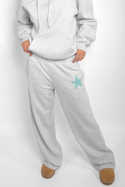 Wide-leg joggers with star patch | Subdued