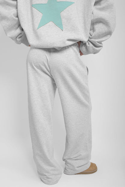 Wide-leg joggers with star patch | Subdued