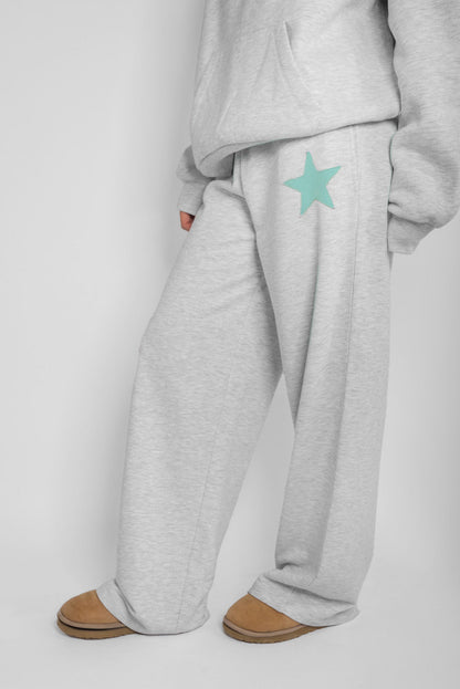 Wide-leg joggers with star patch | Subdued