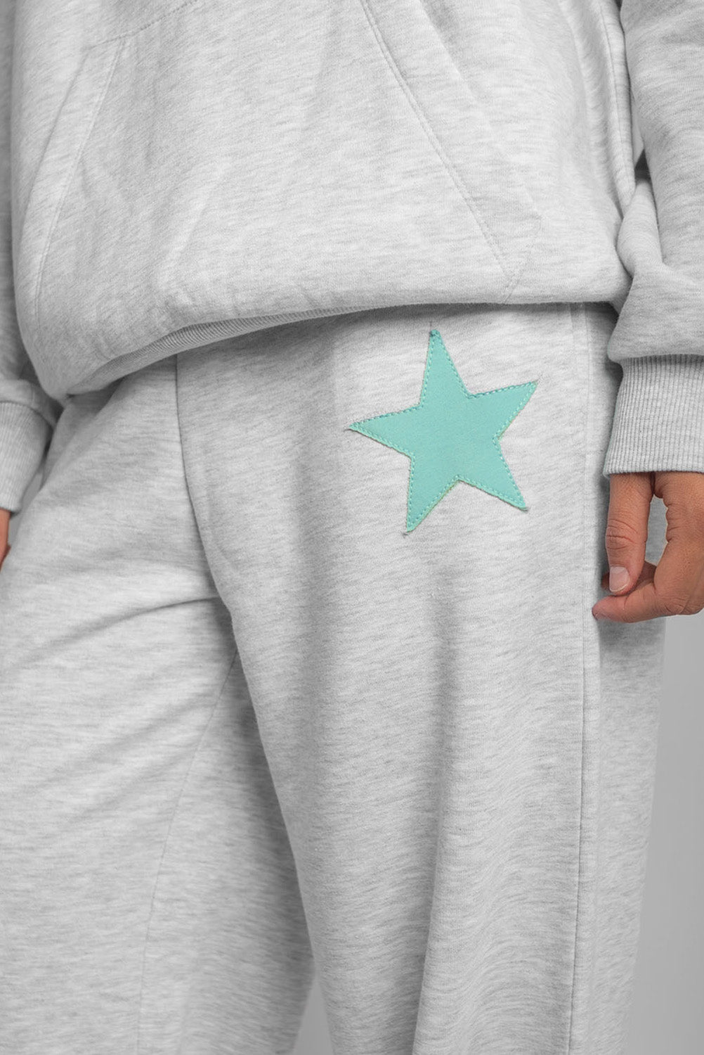 Wide-leg joggers with star patch | Subdued